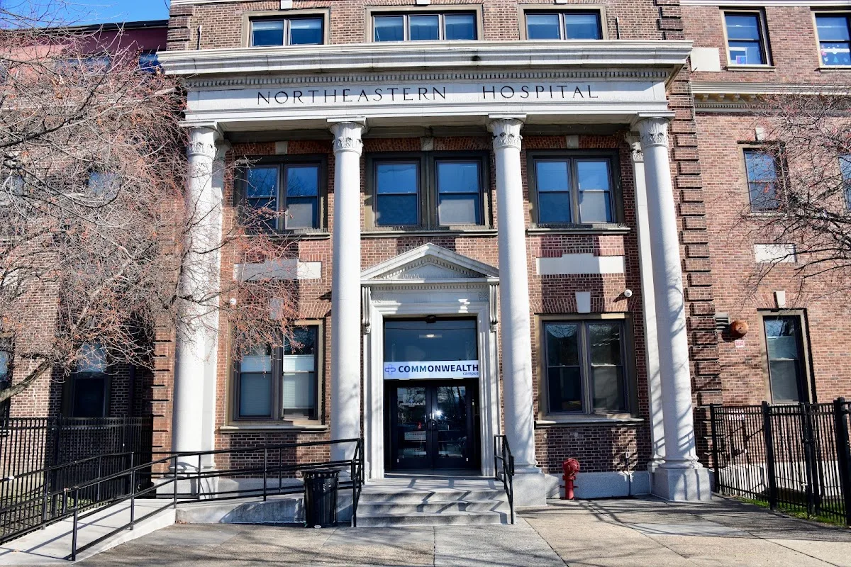 Historic brick facade of Northeastern Hospital, a treatment center in Philadelphia.